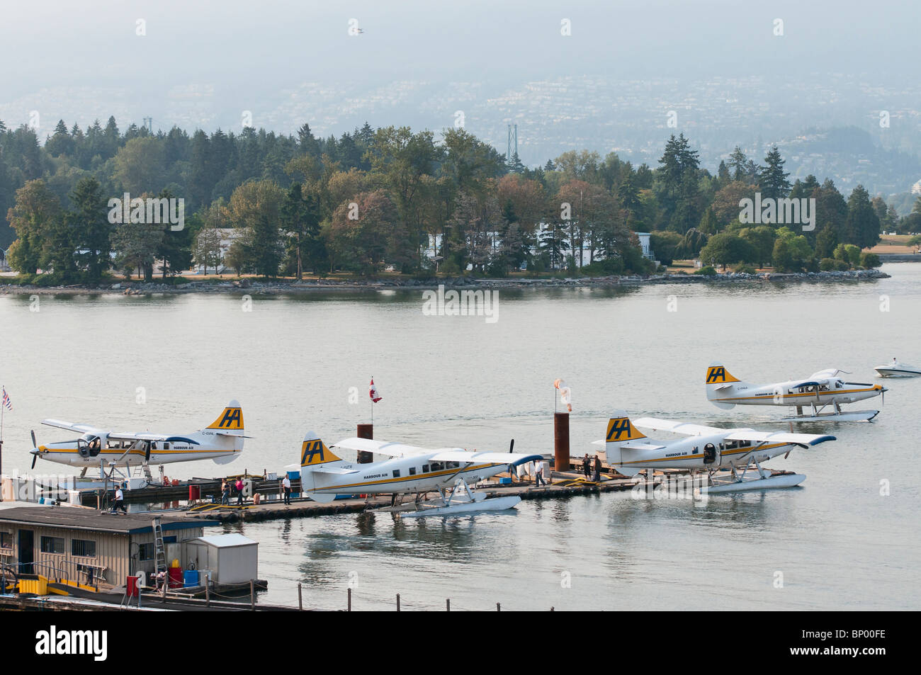 A high angle view of four Harbour Air seaplanes (de Havilland Canada DHC-3T ) in Coal Harbour, Vancouver, Canada. Stock Photo