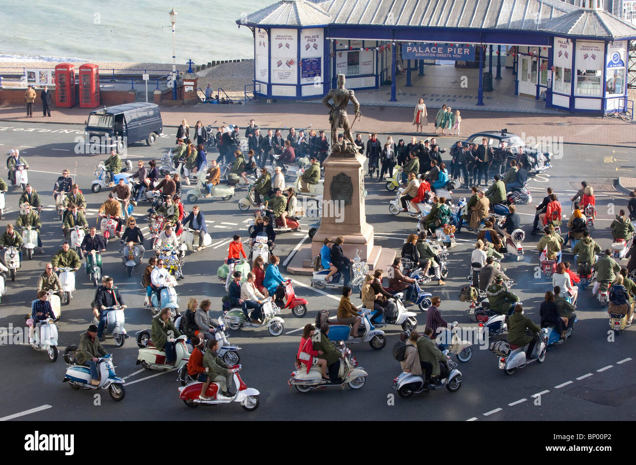 Film extras ride along Eastbourne Seafront on scooters during the