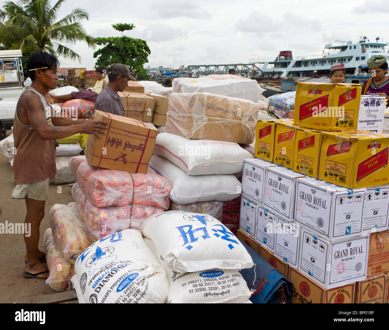 manual labourer stacking boxes, Yangon docks, Myanmar Stock Photo Alamy