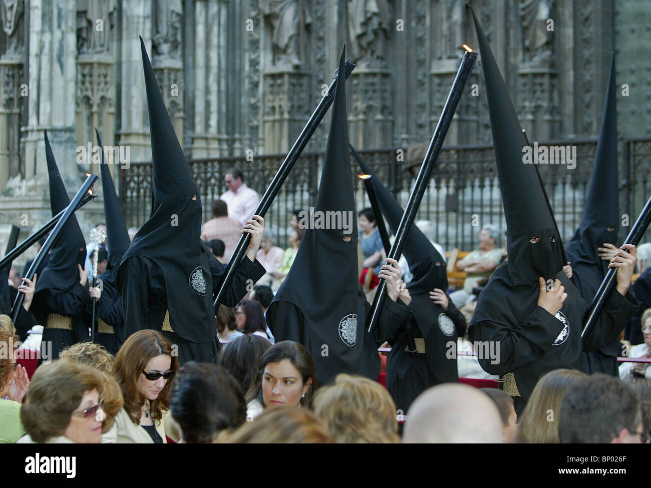 Black hooded members of a Brotherhood during the Semana Santa processions in Seville, southern Spain on April 6, 2004. Stock Photo