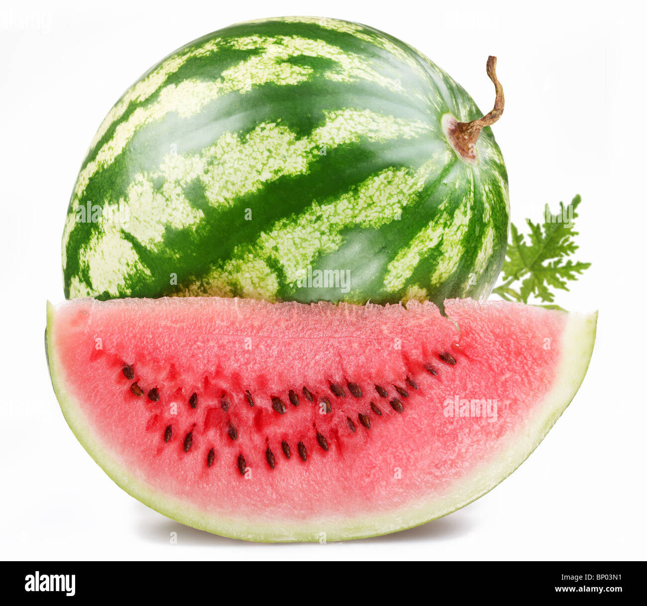 ripe watermelon with a slice on a white background Stock Photo