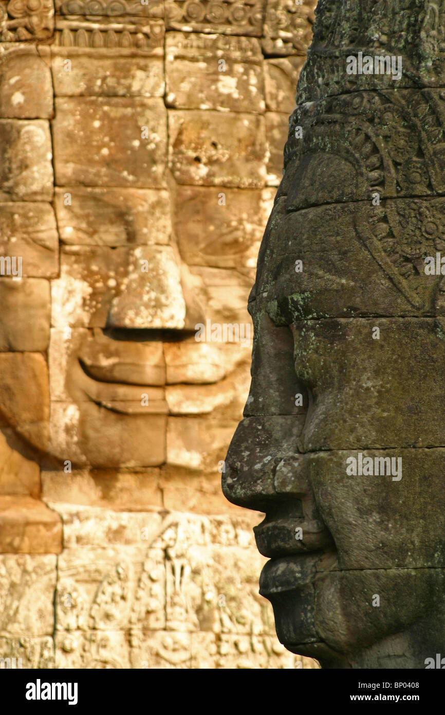 giant faces made of stone inside the Temple Bayon - Angkor Thom Stock Photo