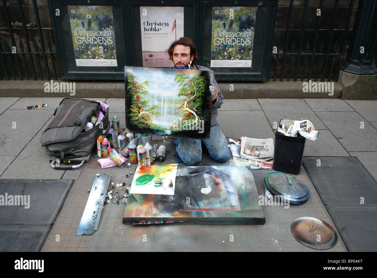 A street artist busking outside the National Gallery of Scotland during the annual Edinburgh Festival. Stock Photo