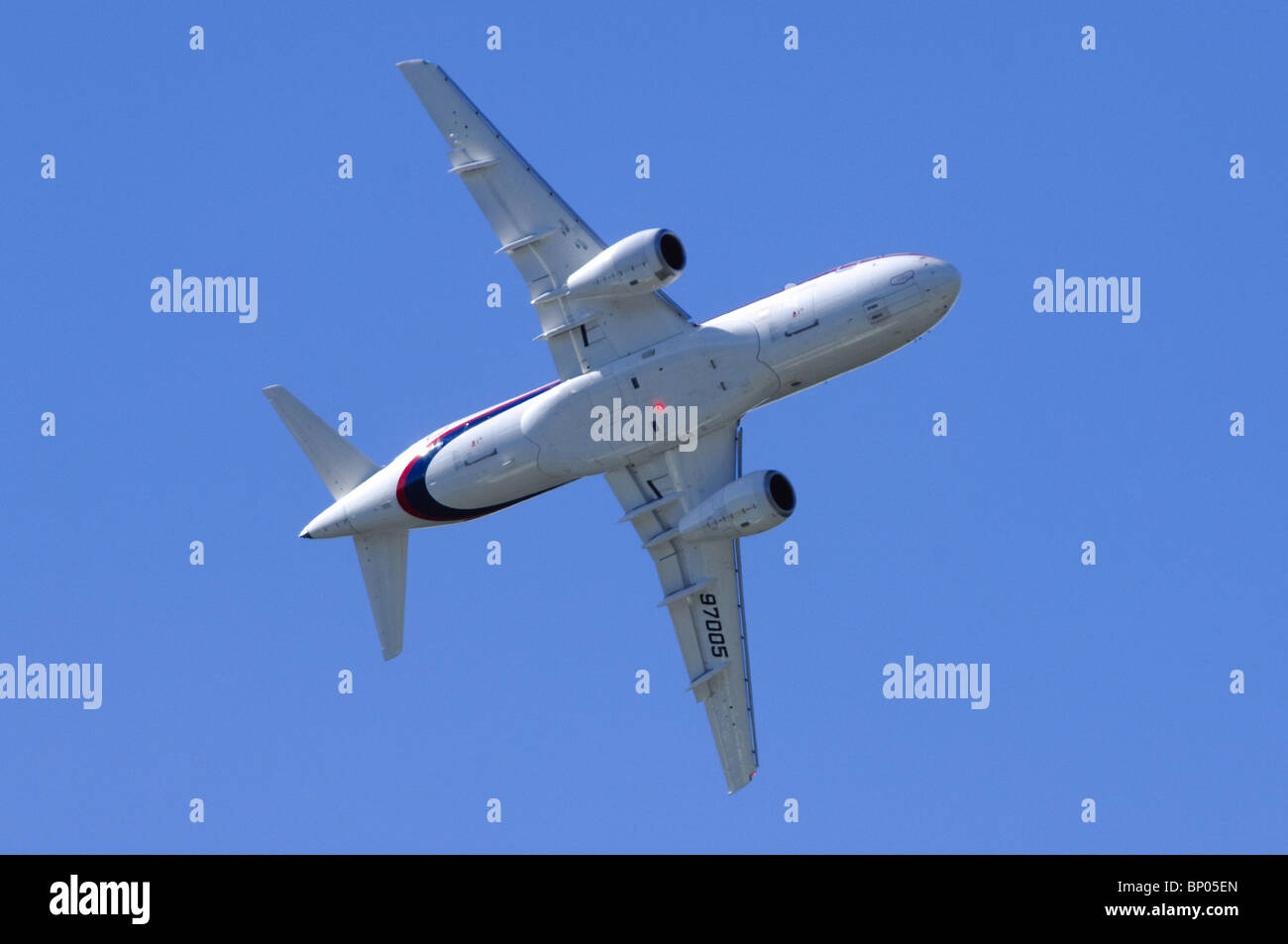 Sukhoi Superjet 100 making a banking flypast at the Farnborough Airshow Stock Photo