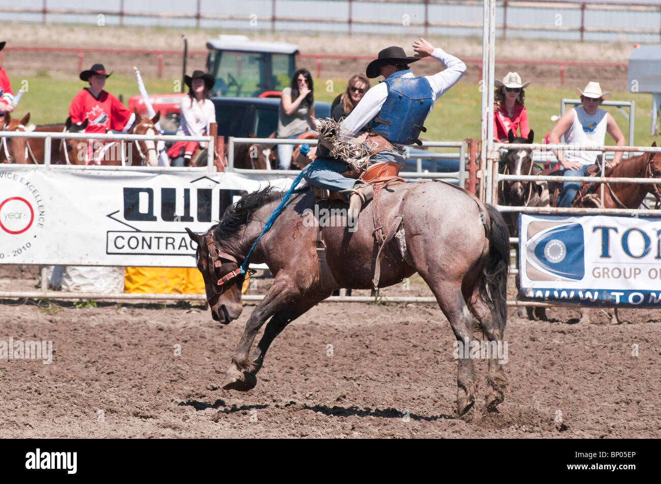 Cowboy, saddle bronc riding, Rocky Mountain House Rodeo, Rocky Mountain