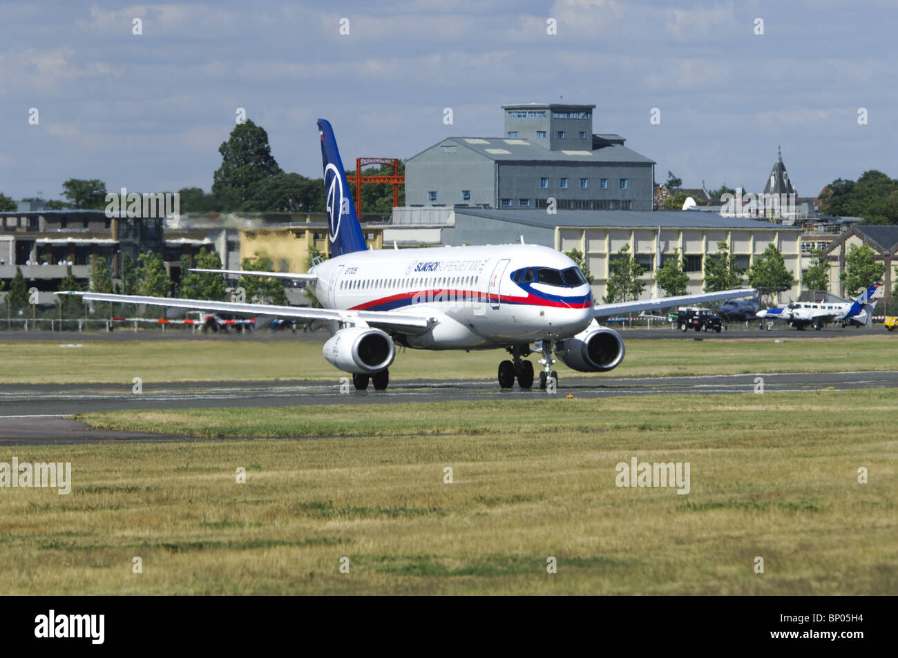 Sukhoi Superjet 100 taxiing onto the runway at the Farnborough Airshow Stock Photo