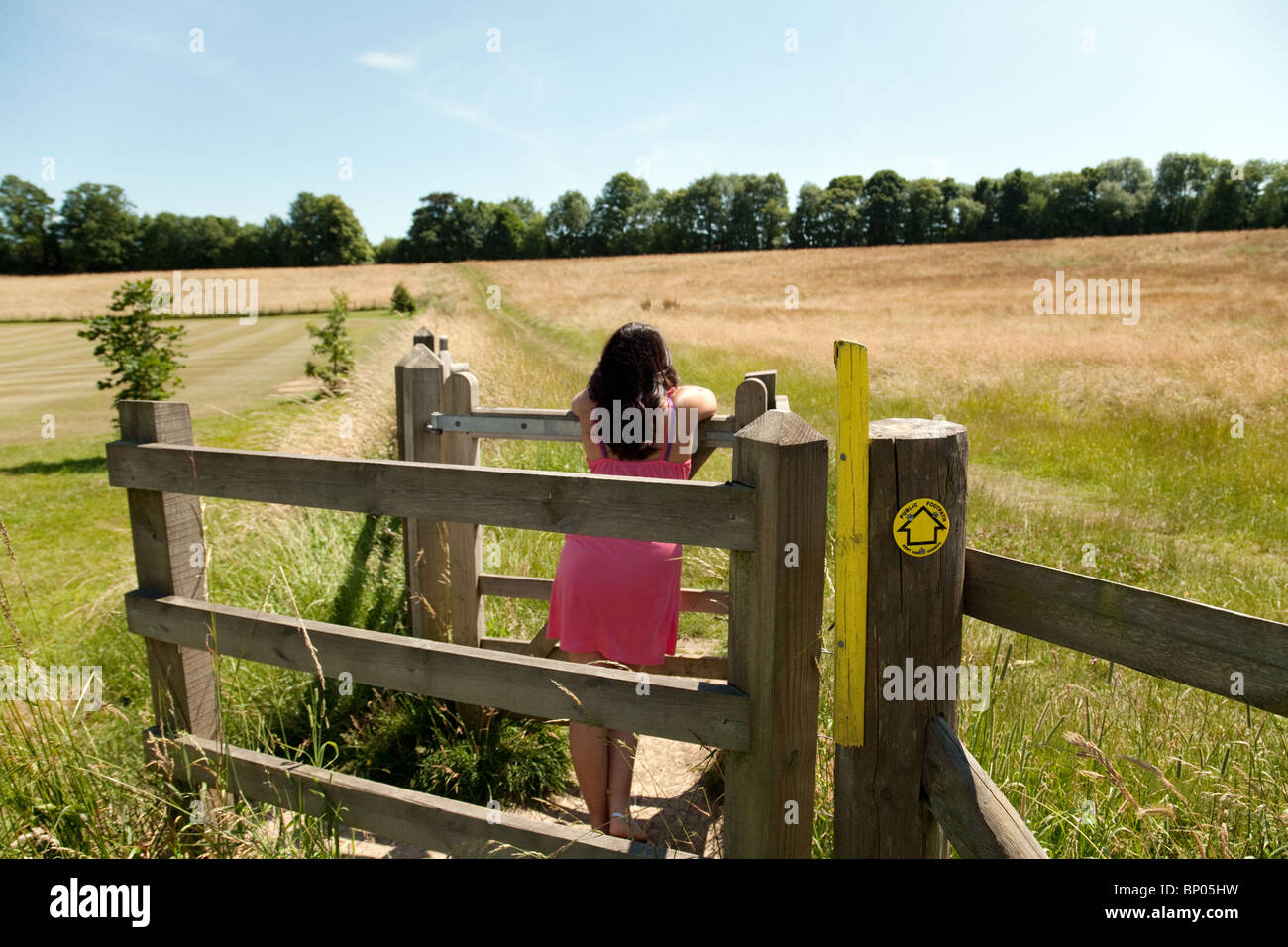 Teenage girl walking in the Kent countryside; Lyminge near Folkestone, Kent UK Stock Photo