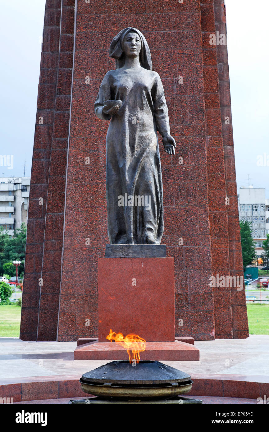 Kyrgyzstan - Bishkek - Victory Square - eternal flame and statue at the monument to World War Two Stock Photo