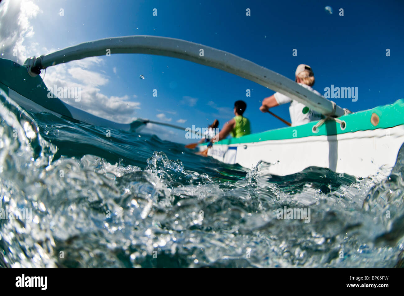 Women paddling outrigger canoe, Kailua Bay, Oahu, Hawaii, USA Stock