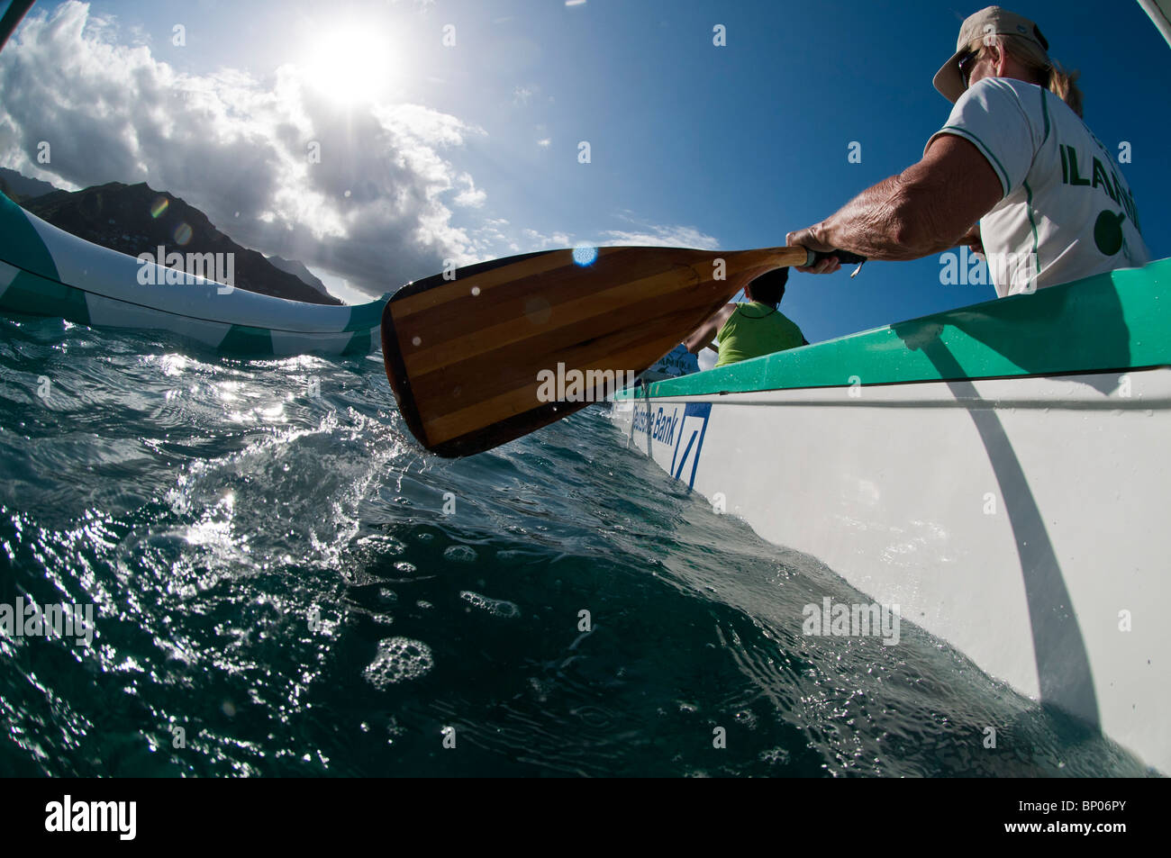 Women paddling outrigger canoe, Kailua Bay, Oahu, Hawaii, USA Stock
