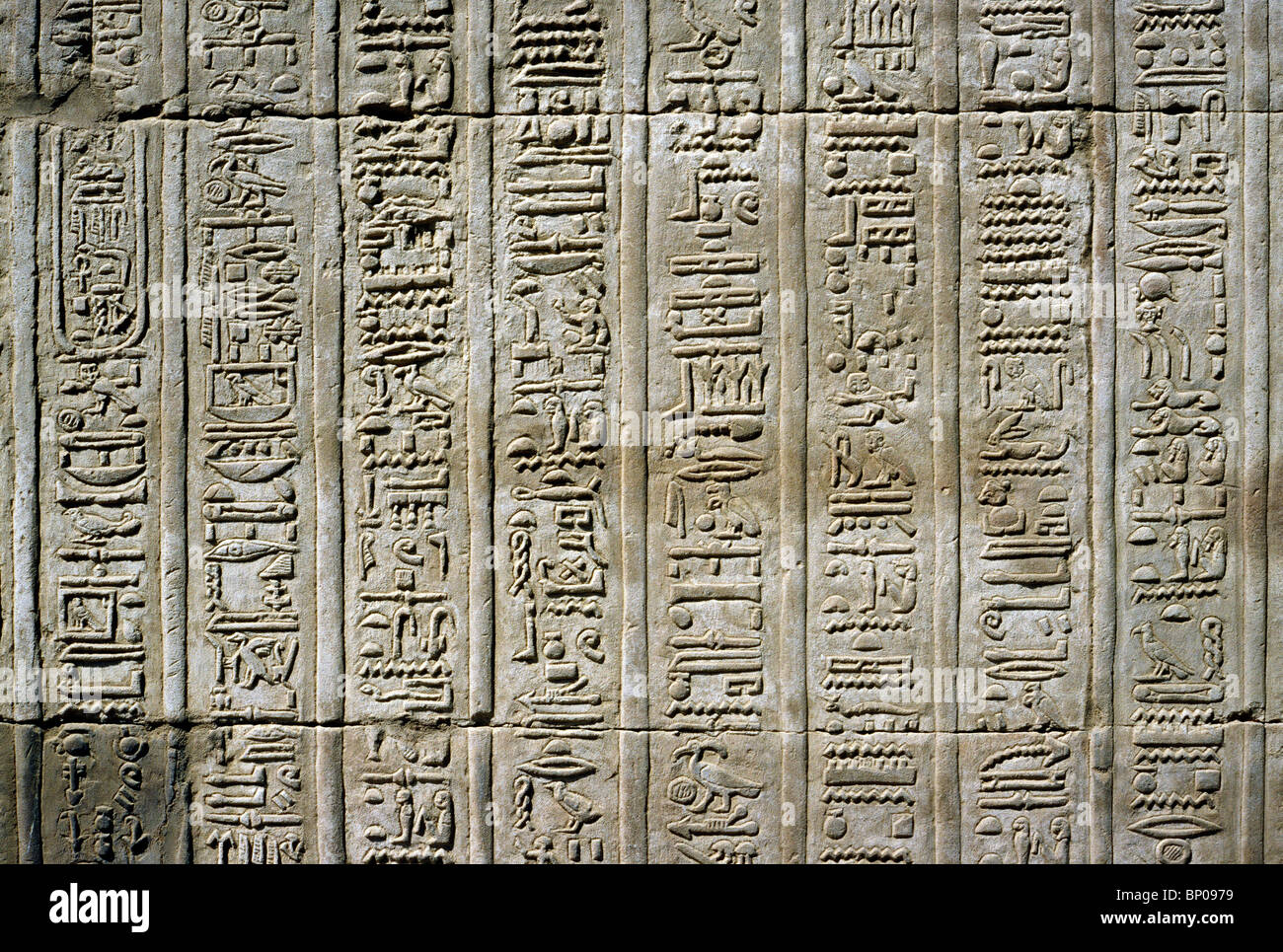 Hieroglyphs on a wall at Kom Ombo temple near Aswan in Upper Egypt. Stock Photo