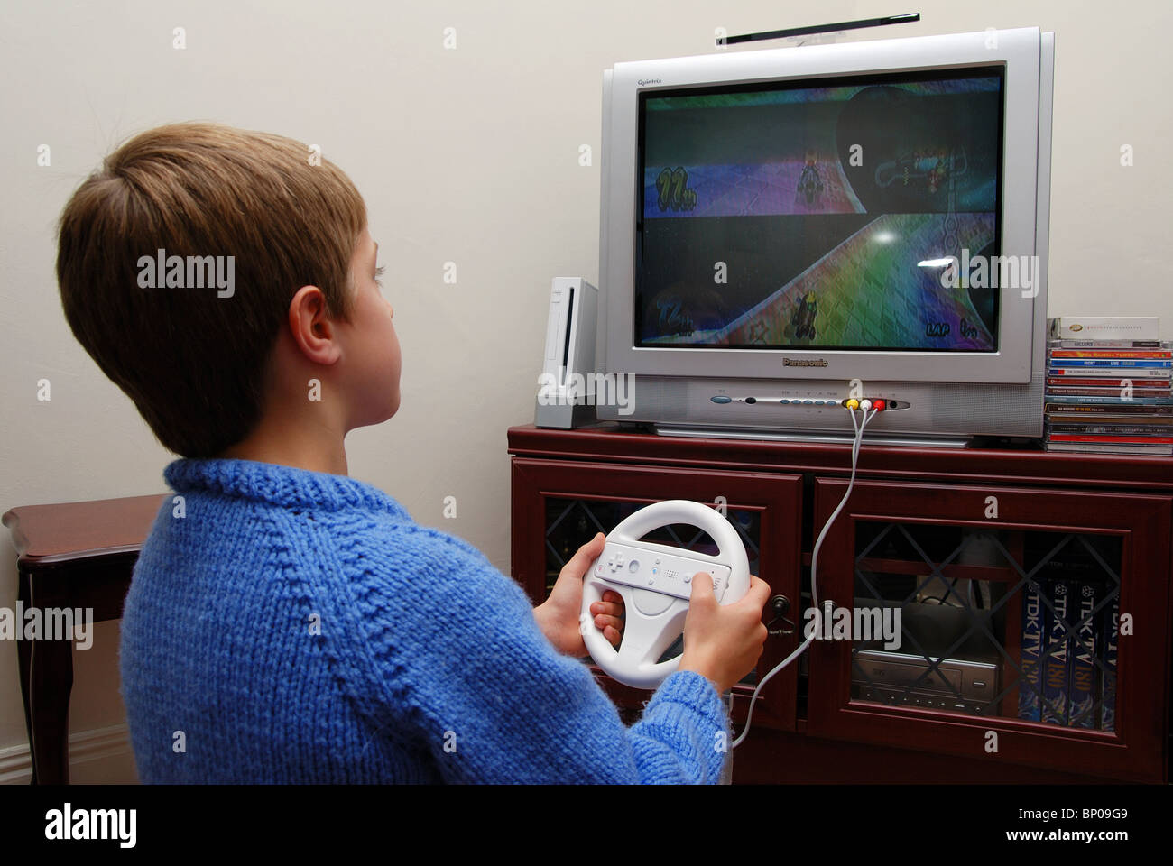 a young boy playing on a wii at home in the living room, england, uk Stock  Photo - Alamy