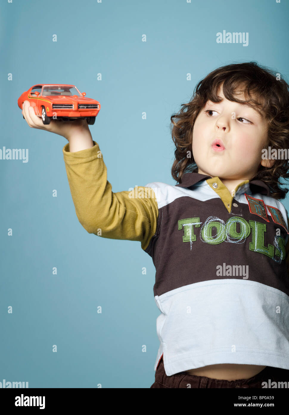 Little boy playing with toy car Stock Photo - Alamy