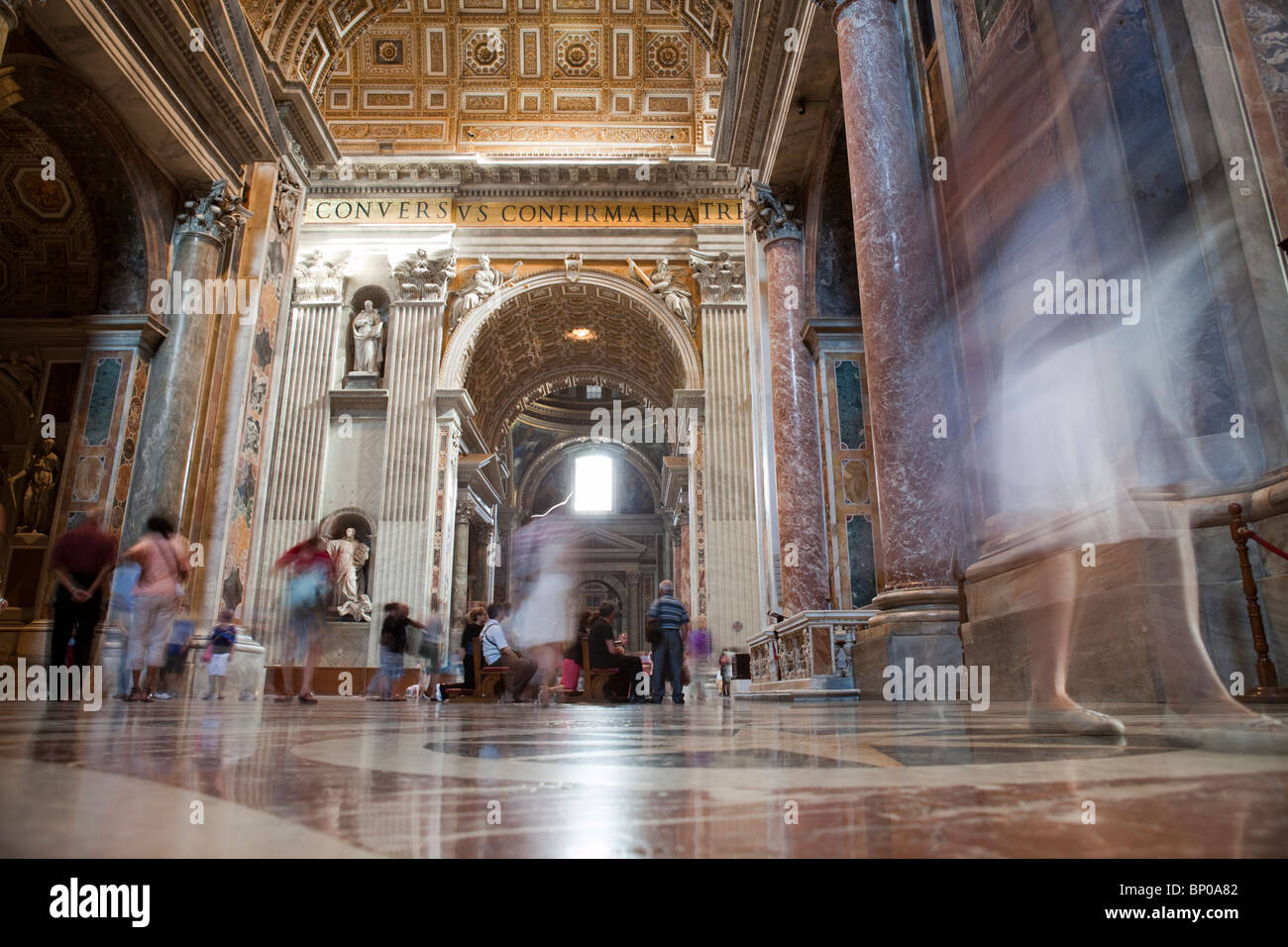 Tourists walking around the Saint Peter basilica, Vatican Stock Photo