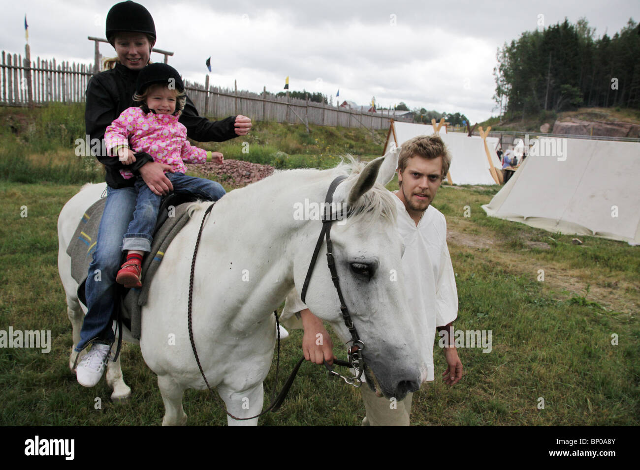 Children's horse trip at Finland's biggest Viking Market Festival at Kvarnbo on Åland archipelago Stock Photo