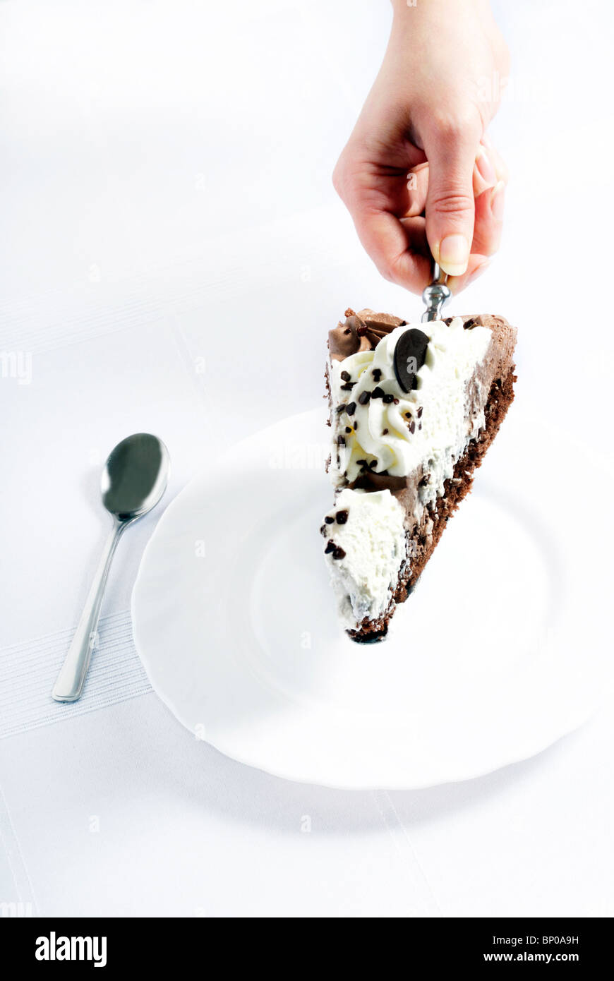 serving a slice of chocolate cake Stock Photo