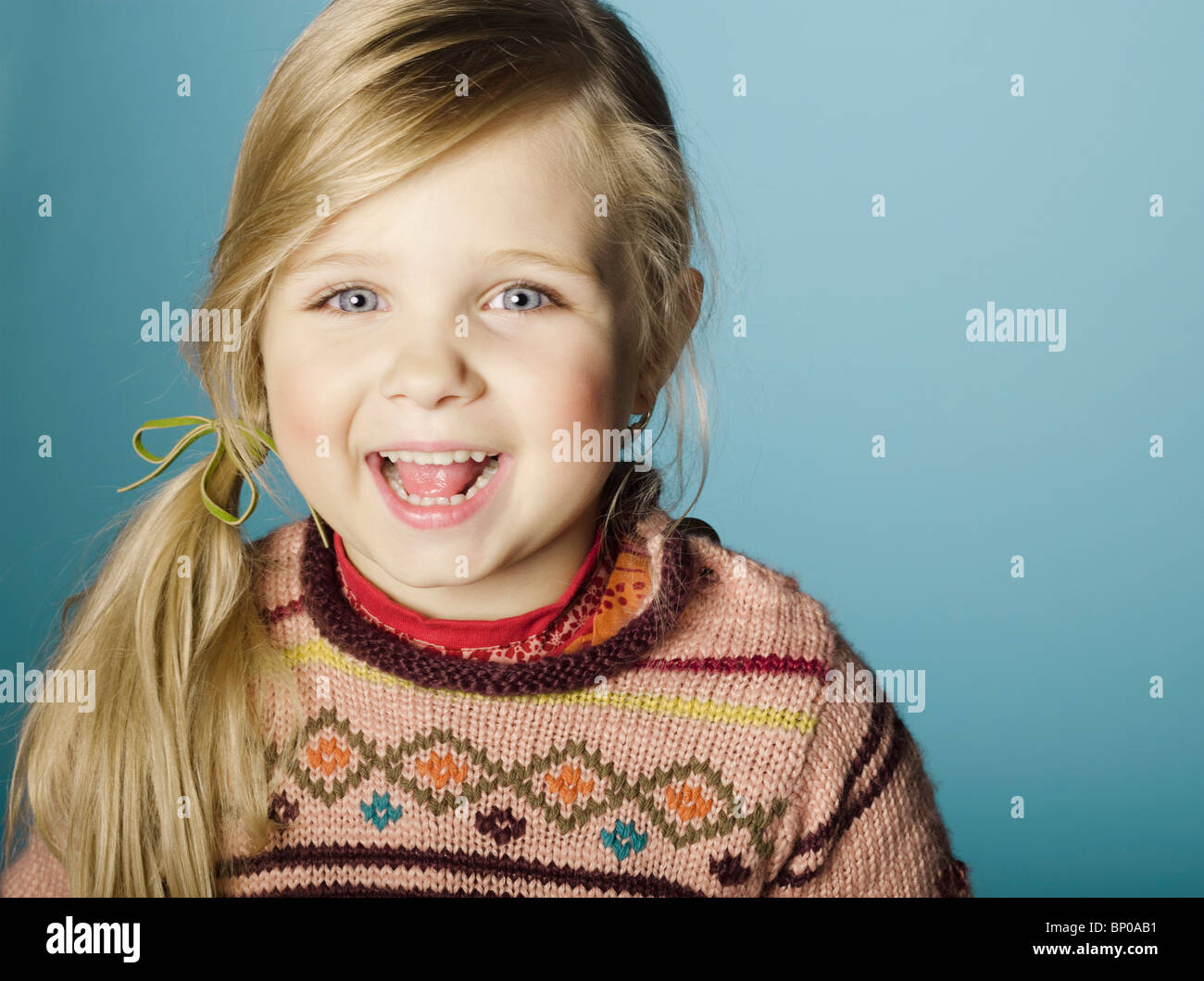 Portrait of little girl smiling for camera Stock Photo - Alamy