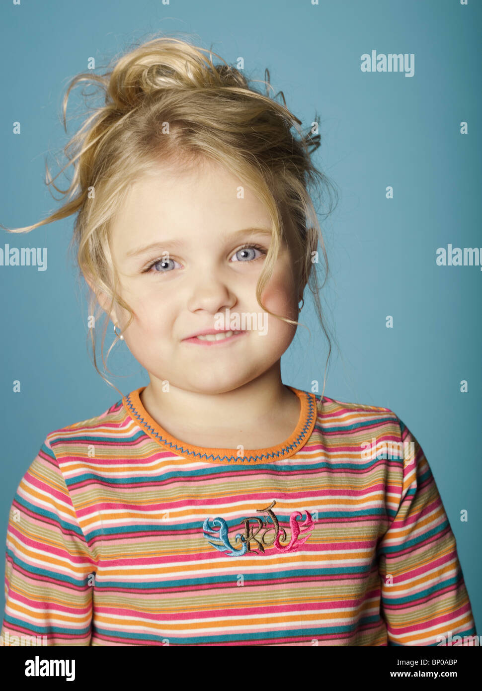 Portrait of little girl looking at camera Stock Photo - Alamy
