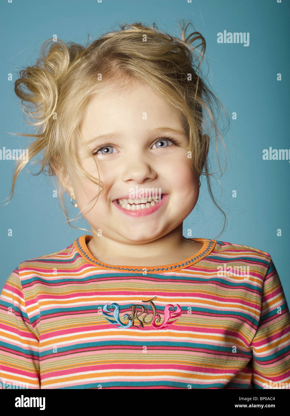 Portrait of little girl smiling for camera Stock Photo - Alamy