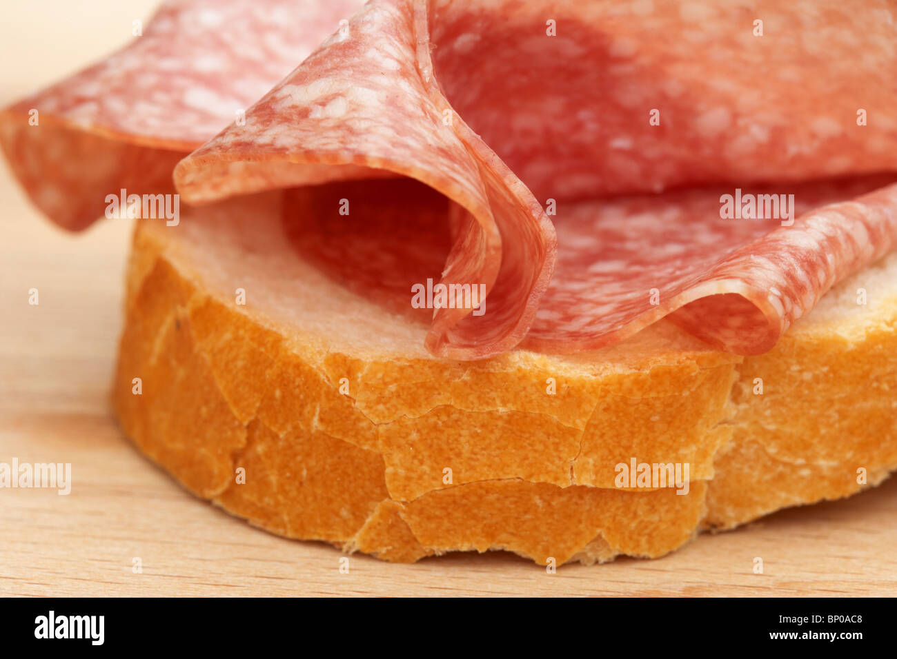 slices of salami in a sandwich Stock Photo Alamy