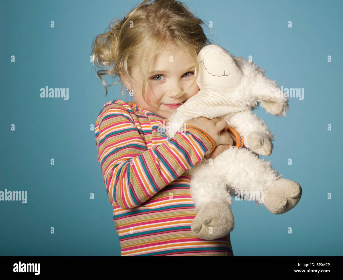 Portrait of little girl with stuffed toy Stock Photo - Alamy