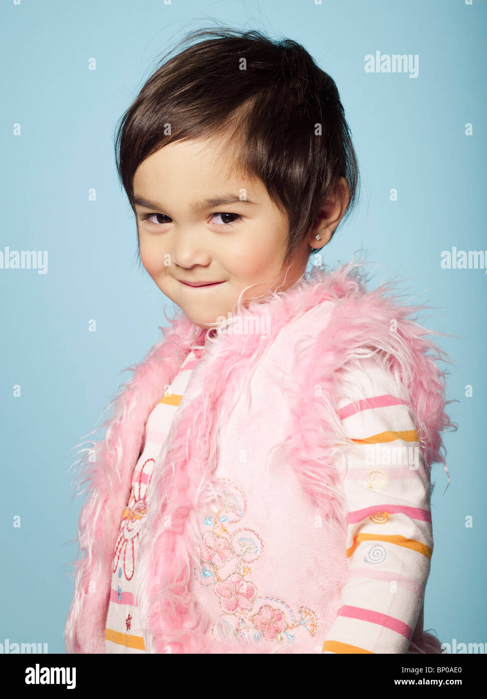 Portrait of little girl looking at camera Stock Photo - Alamy