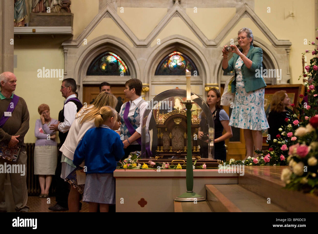 Worshipers view the relics of Saint Therese of Lisieux at St John's ...