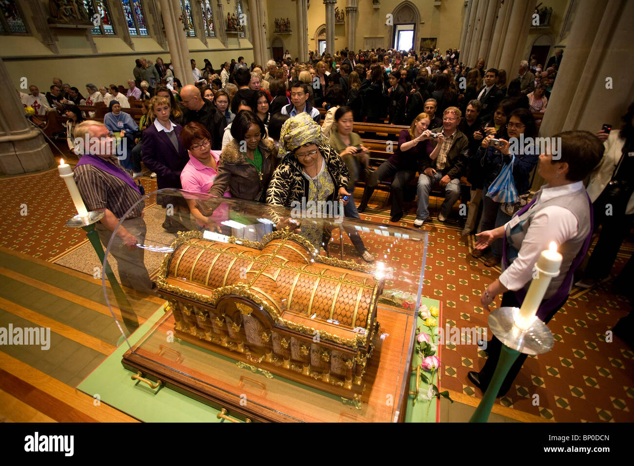 Worshipers file past the relics of Saint Therese of Lisieux at St John ...