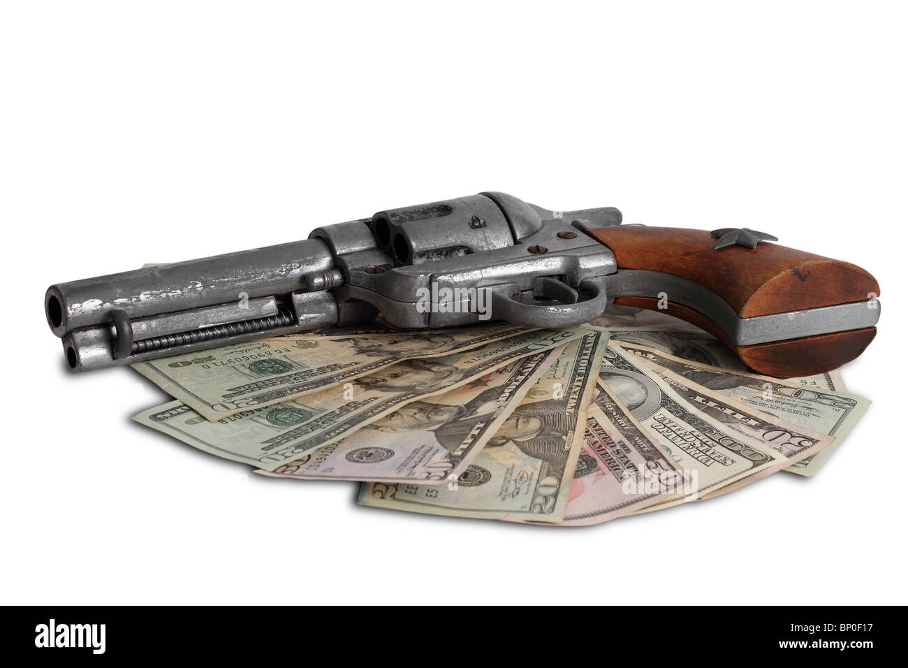 Money and a gun on  Wild West Stock Photo