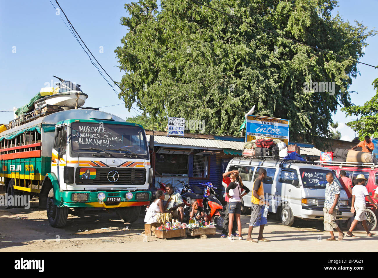people and luggage at a taxibrousse (bush taxi) station