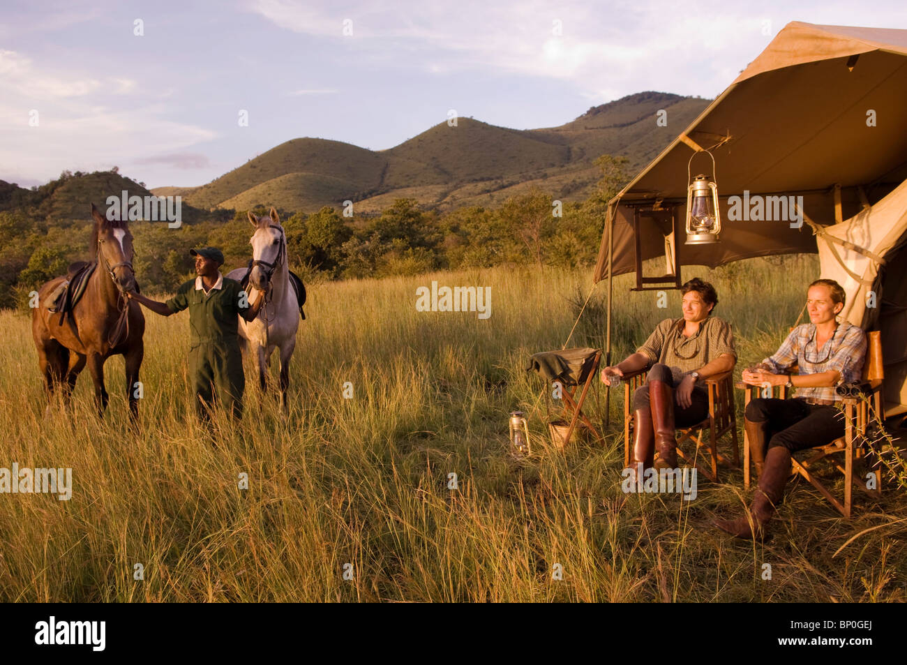 Kenya, Chyulu Hills, Ol Donyo Wuas. Couple on a horse riding safari