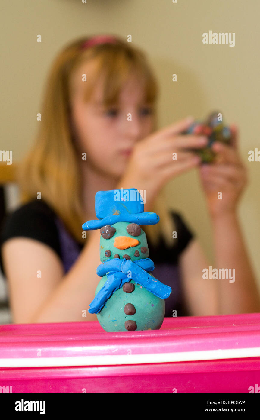 Child playing with Play Dough Stock Photo
