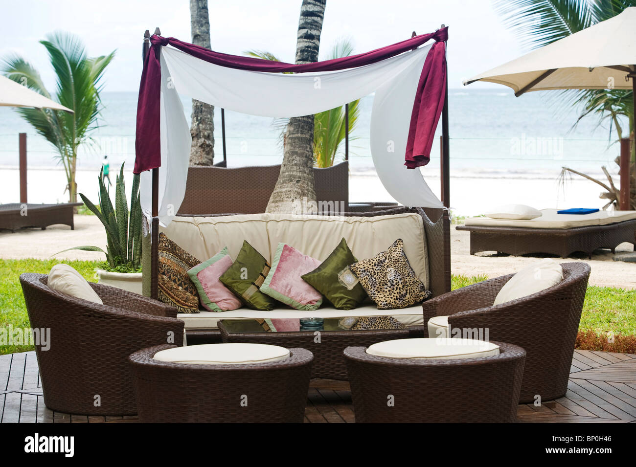 Kenya, Coast, Diani Beach. Stylish sunloungers on the beach front at Almanara Beach Resort. Stock Photo