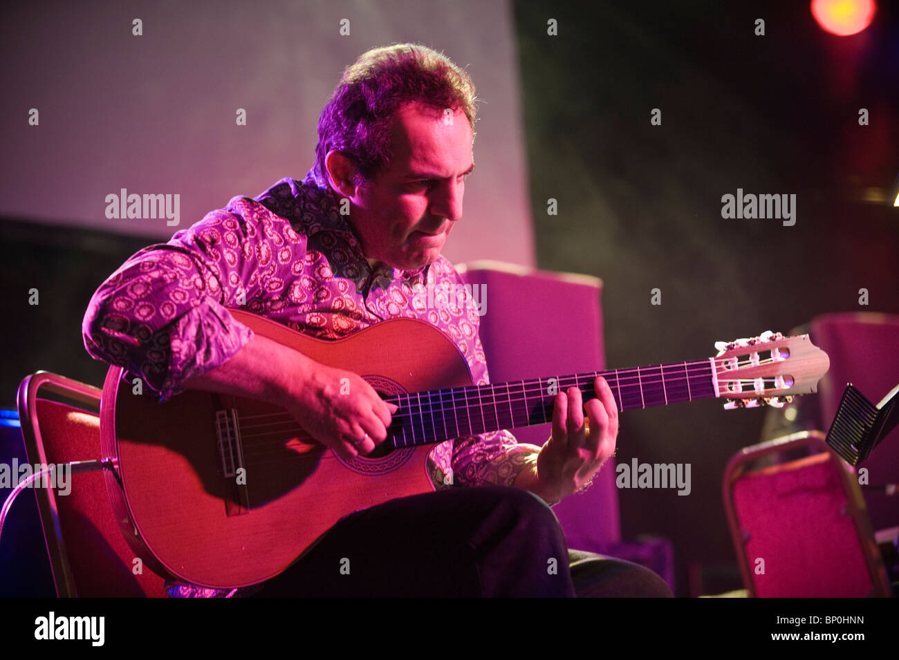 John Parricelli jazz guitarist playing acoustic guitar with the Andy Sheppard Band at Brecon Jazz Festival 2010 Stock Photo