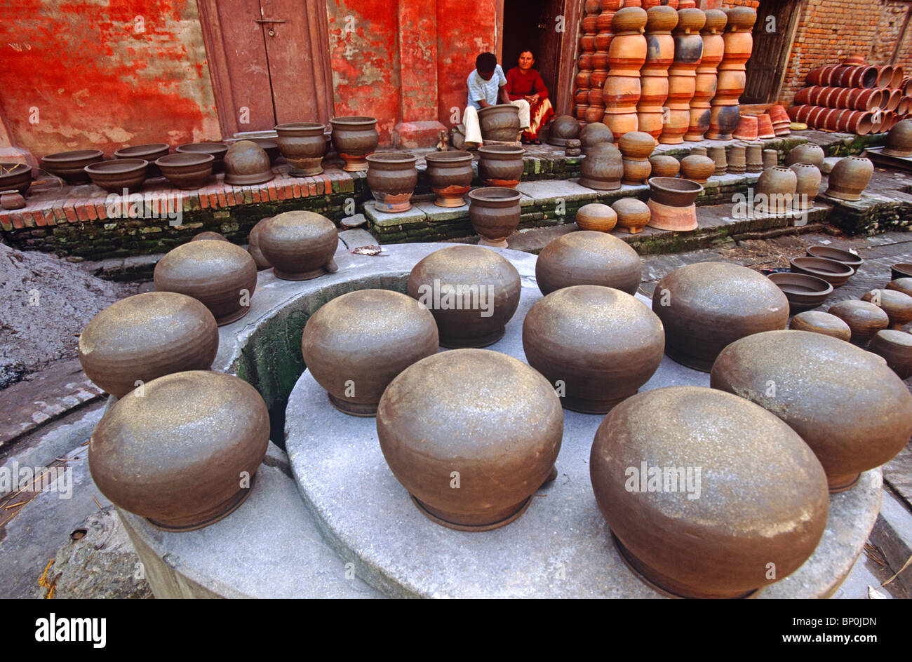 Making traditional clay pots for water and grain storage, Thimi