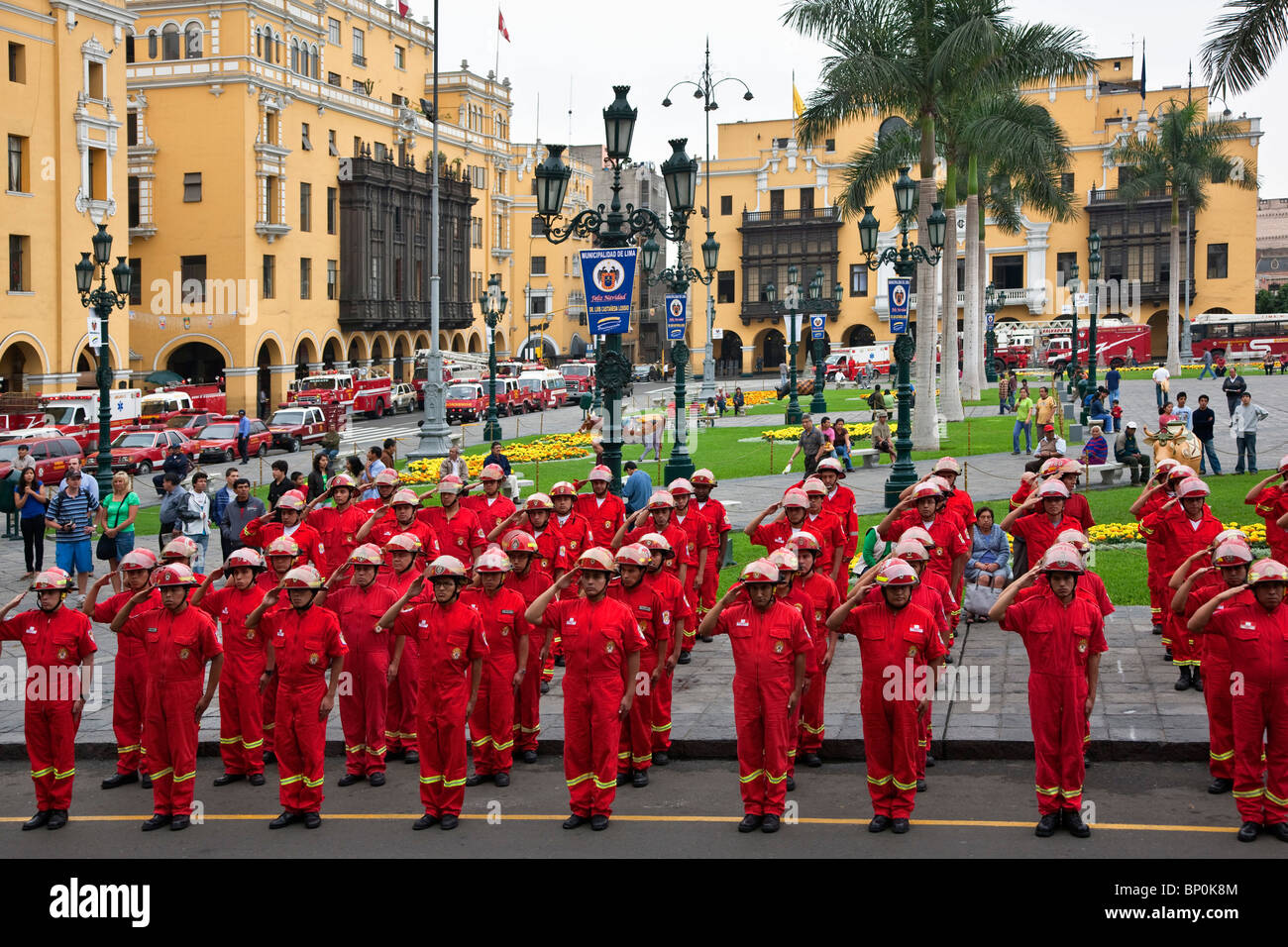 Peru. Members of Lima’s fire brigade parade outside Lima Cathedral on a corner of Plaza Mayor. Stock Photo