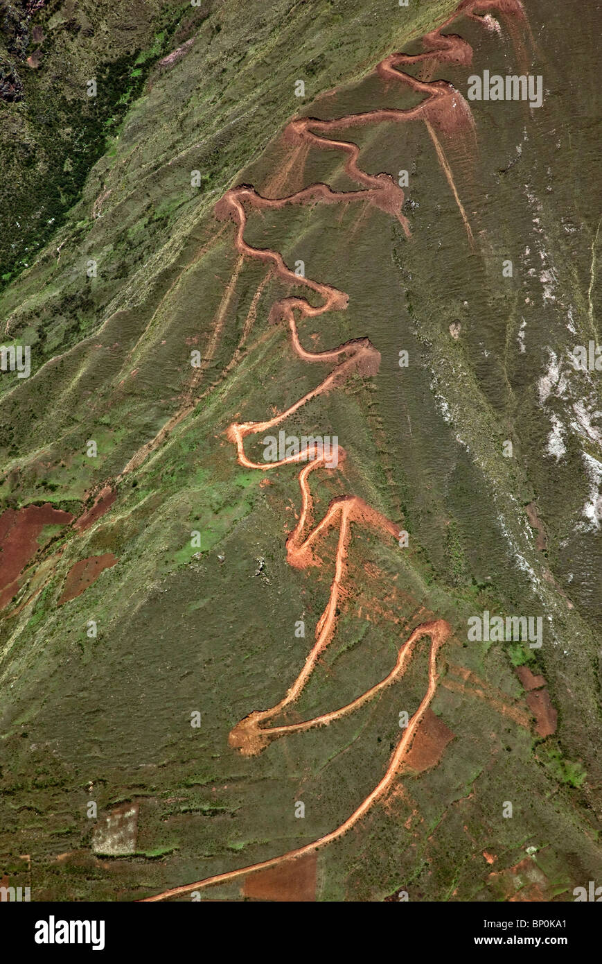 Peru. A trail zigzags up a steep ridge on the Andean Mountains east of Cusco. Stock Photo