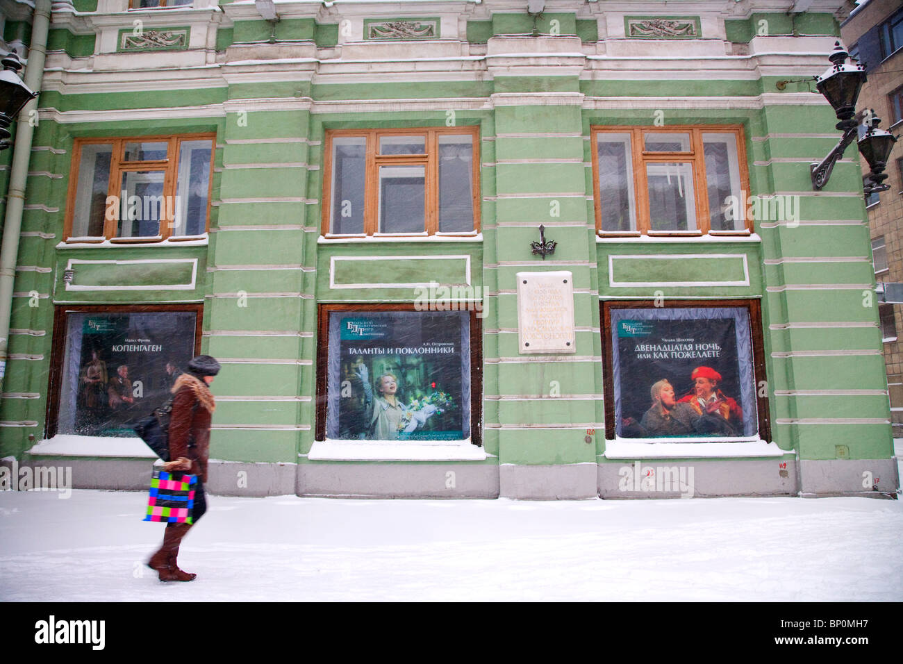 Russia, St. Petersburg; A girl walking in front of the 'Bolshoy Dramaticheski Teatr', one of the main drama theatres of the city Stock Photo
