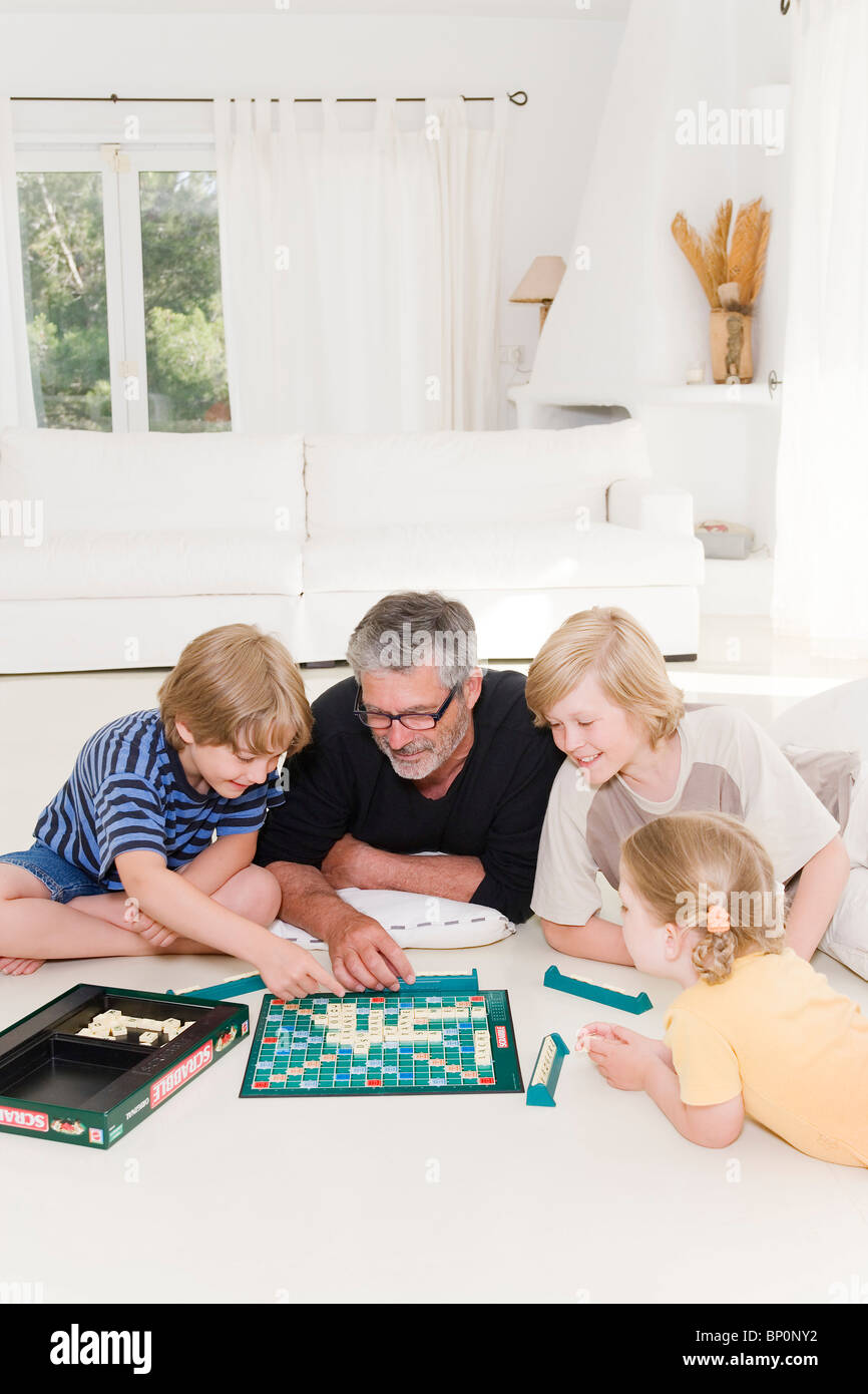 Family playing scrabble Stock Photo