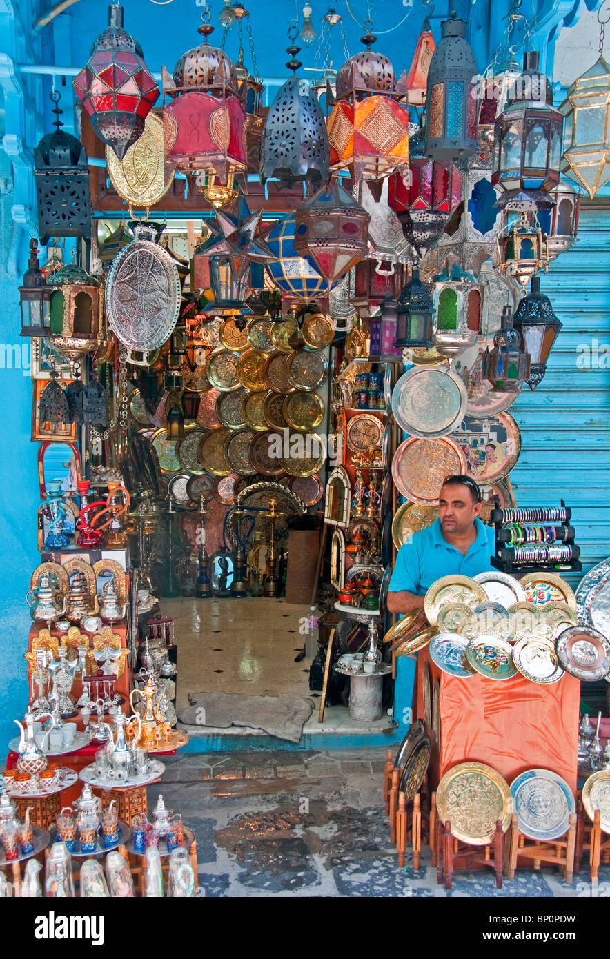 Souk merchant in his shop in the Tunis Medina Stock Photo