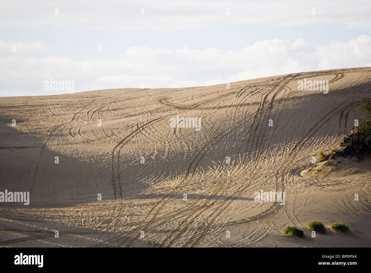 All terrain vehicle tracks though Umpqua Dunes in the Oregon Dunes National recreation area near Coos Bay Oregon Stock Photo