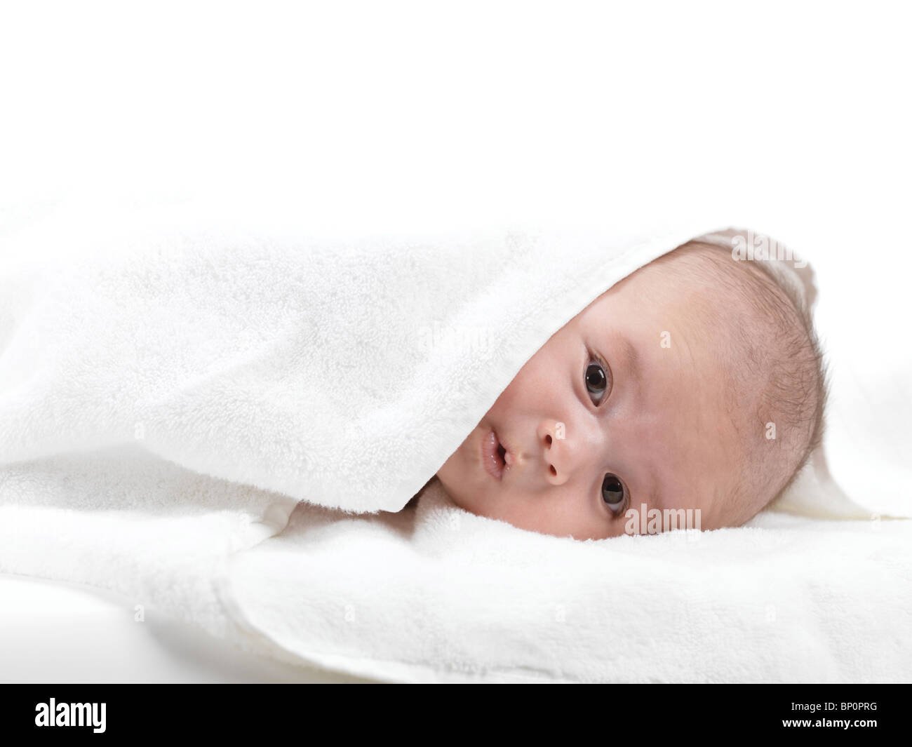Cute three month old baby boy with a funny expression on his face