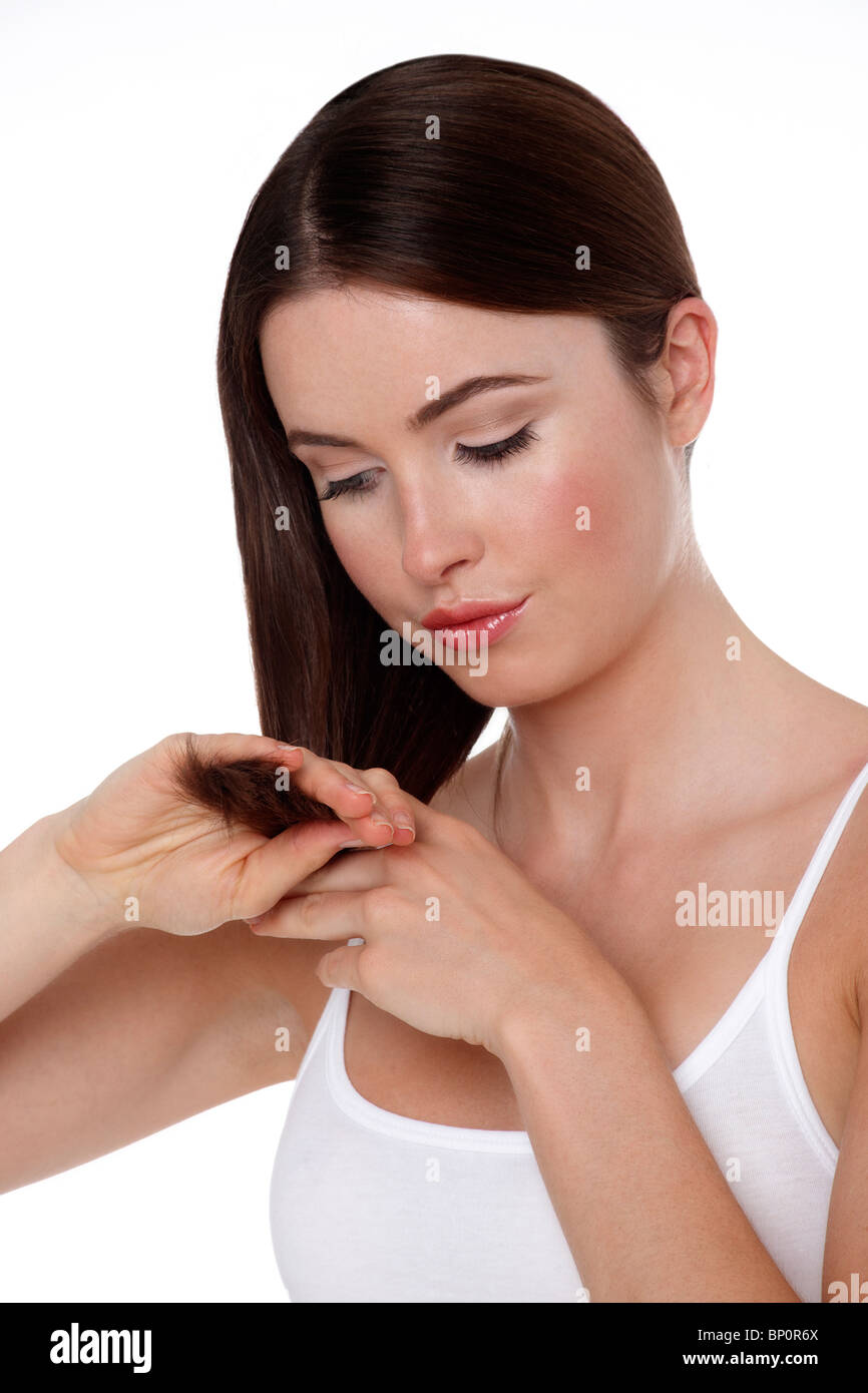 Young woman touching her hair Stock Photo Alamy