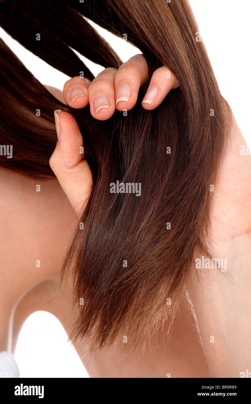Young woman touching her hair Stock Photo Alamy