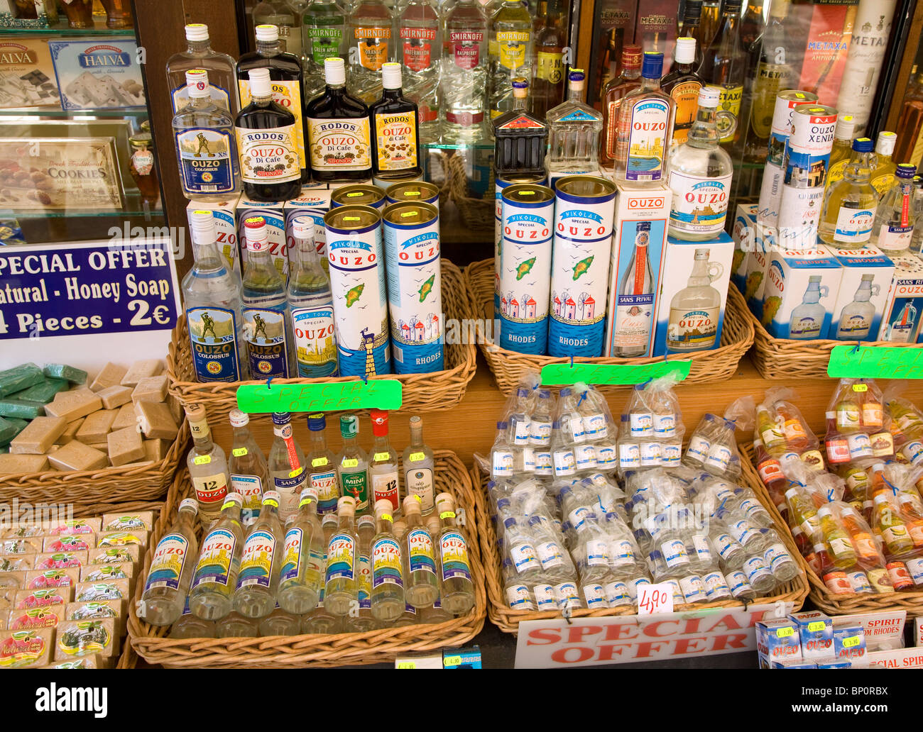 Shop display bottles of ouzo, Rhodes, Greece Stock Photo