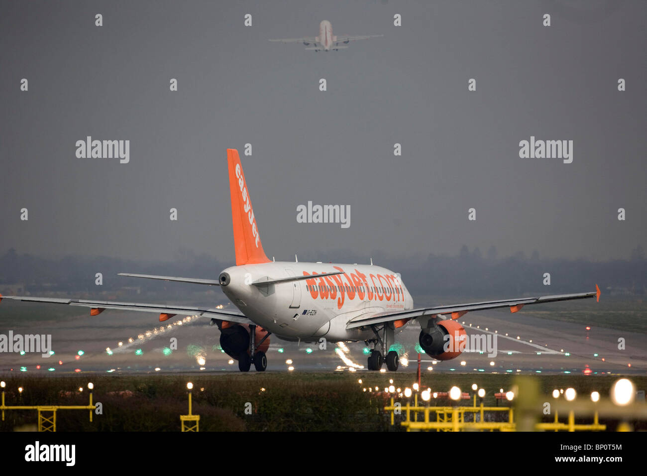 A EasyJet aircraft  taxis onto the runway at Gatwick Airport. Picture by James Boardman Stock Photo