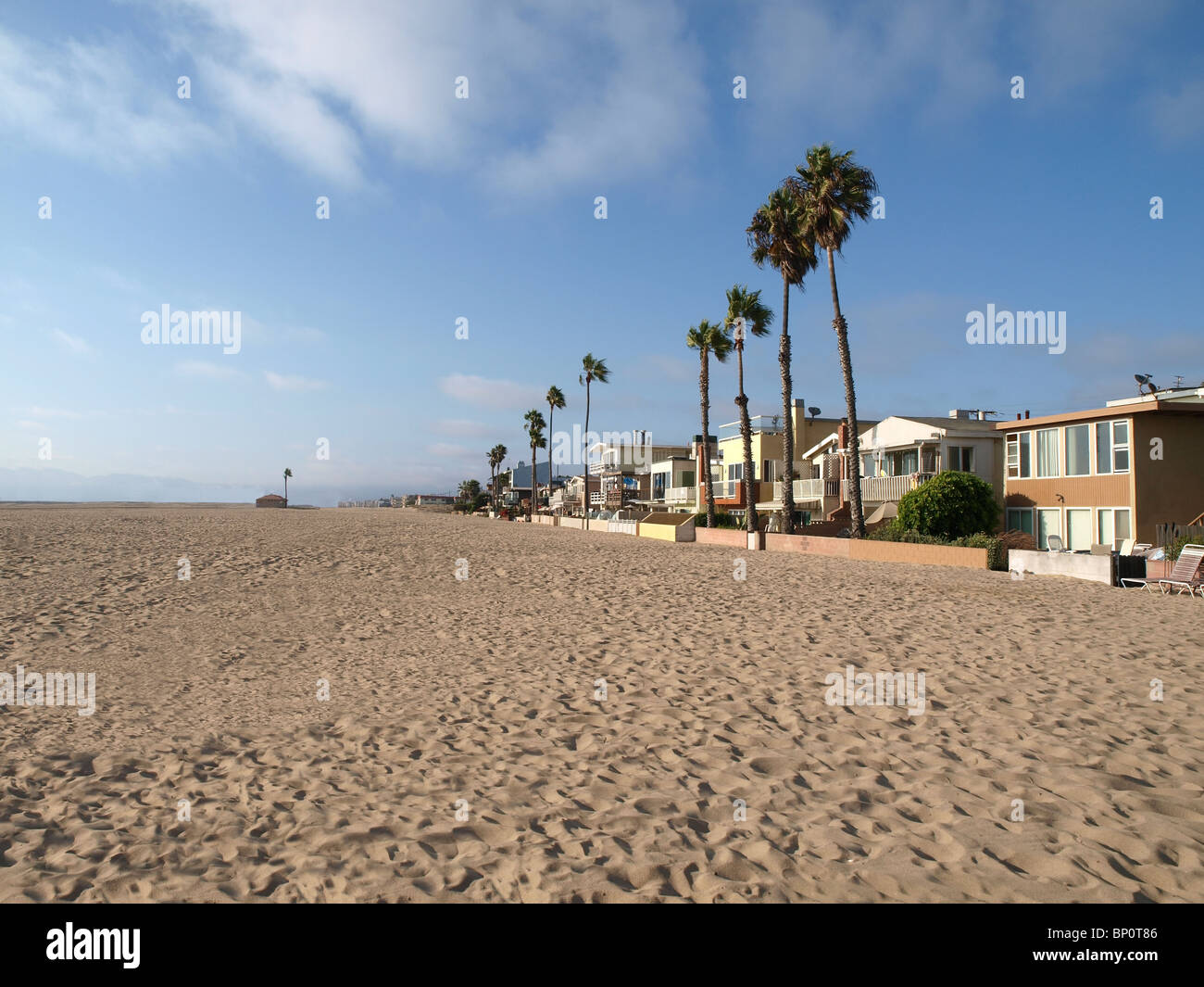 Large beach homes, tall palms and miles of California sand. Stock Photo