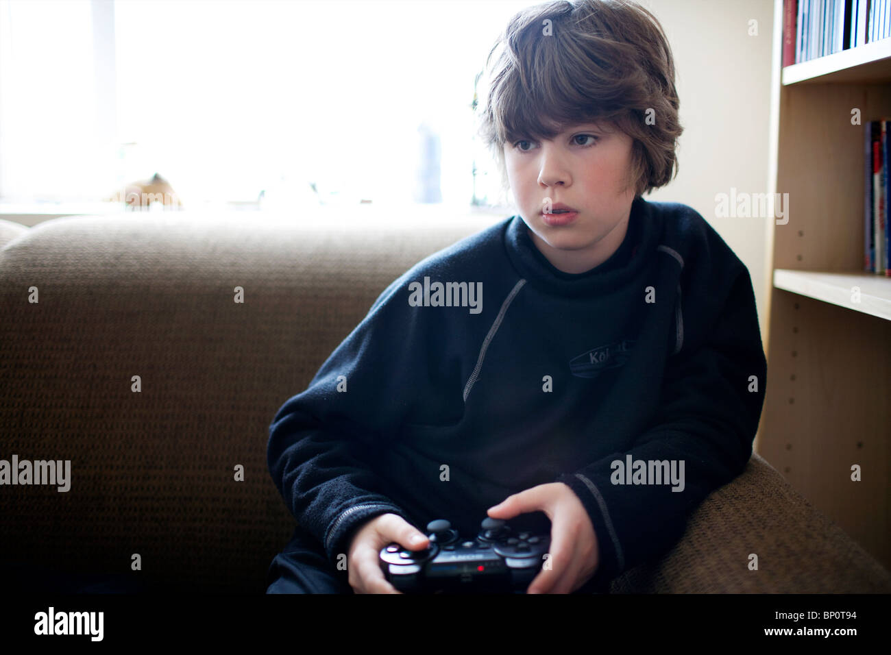 boy playing playstation boy playing playstation