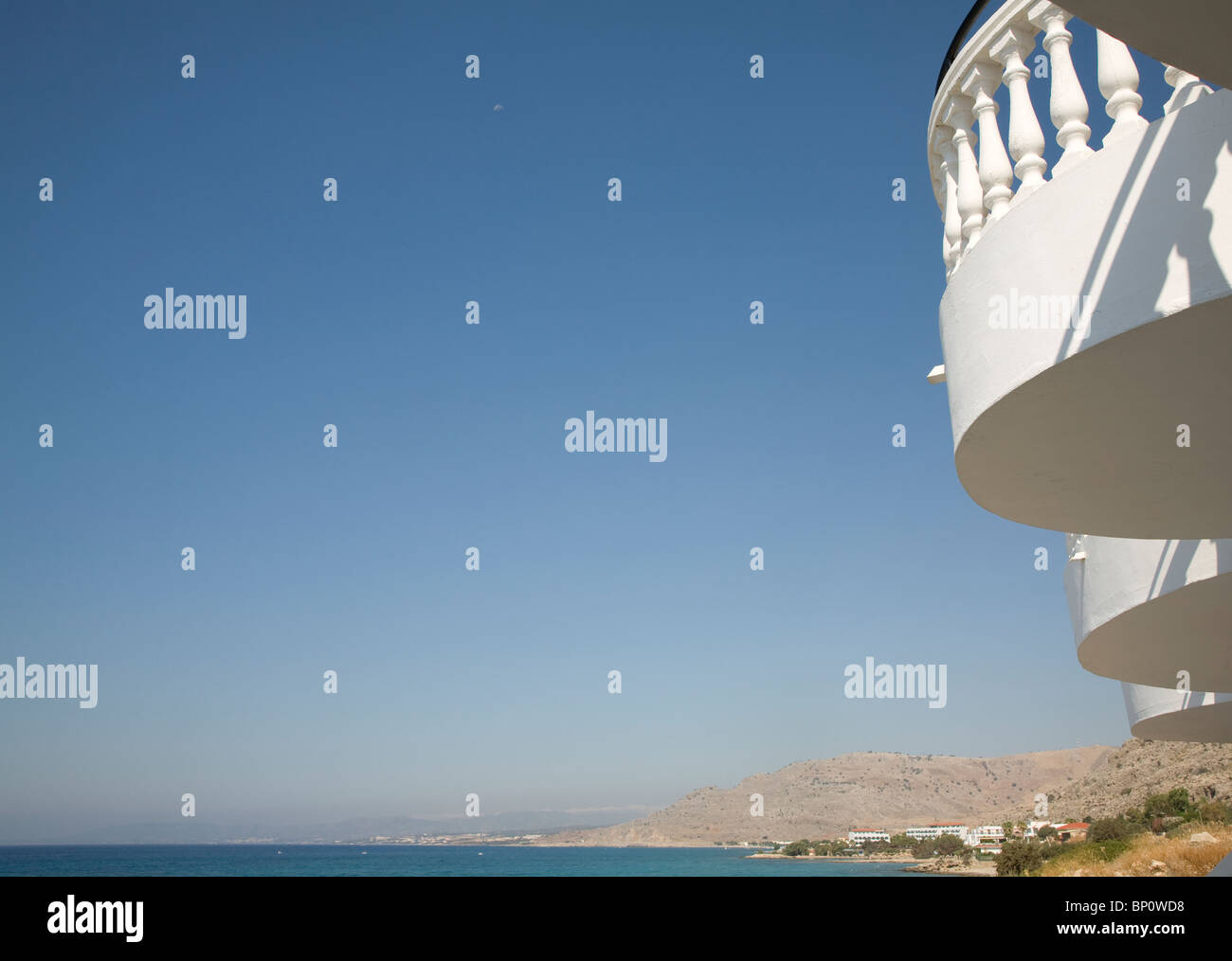 Coastal view with white balcony blue sky, Pefkos, Rhodes, Greece Stock Photo