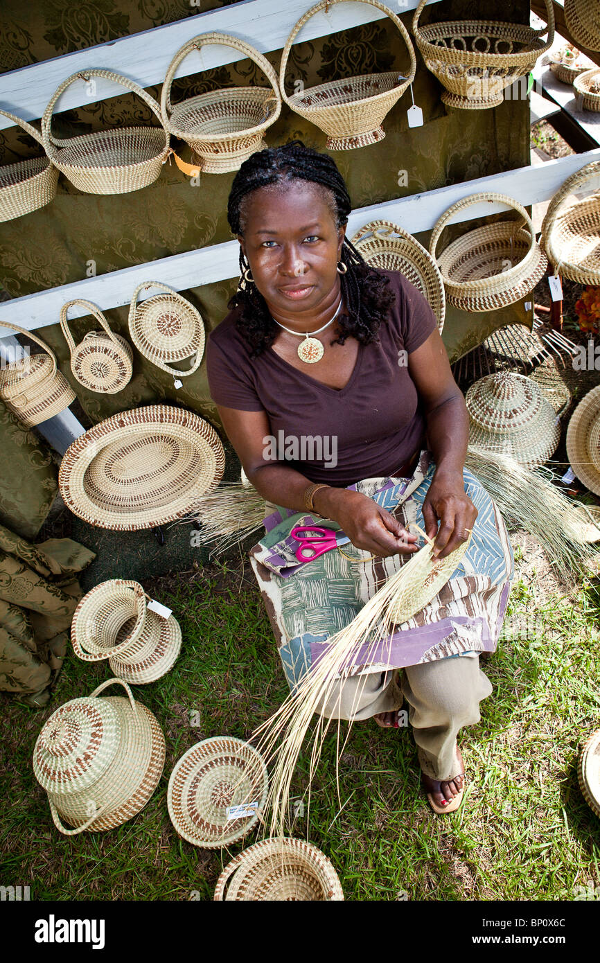 Barbara Manigault, a Gullah sweet grass basket weaver at her stand in